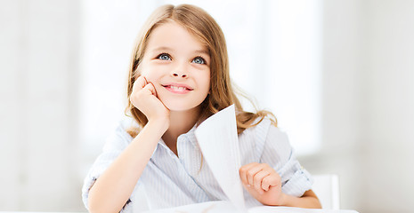 Image showing little student girl studying at school