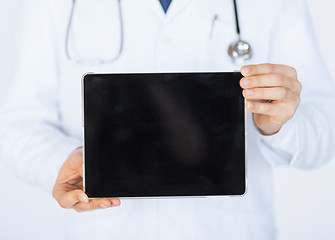 Image showing male doctor holding tablet pc