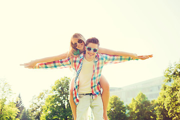 Image showing smiling couple having fun in park