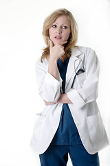 Image showing Lady doctor with hand on chin