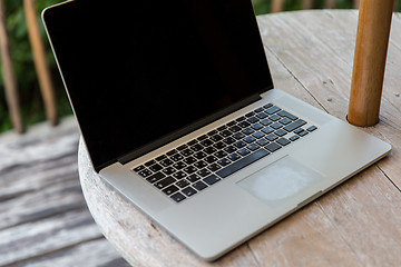 Image showing close up of laptop computer on table at hotel