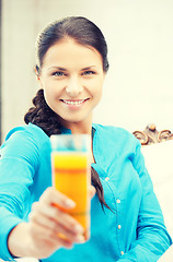 Image showing woman holding glass of orange juice