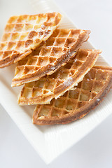 Image showing close up of waffles on plate at breakfast table