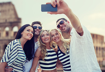 Image showing friends taking selfie with smartphone