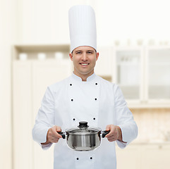 Image showing happy male chef cook holding pot