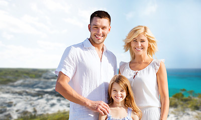 Image showing happy family over summer beach background