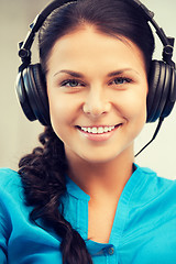 Image showing happy teenage girl in big headphones