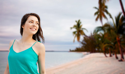 Image showing happy girl or young woman looking aside