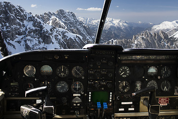 Image showing dashboard in airplane cockpit and mountains view