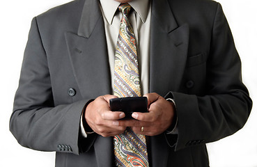 Image showing Business man holding blackberry