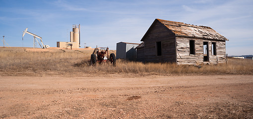 Image showing Fracking Operation Built on Previous Farmland Abandoned Cabin