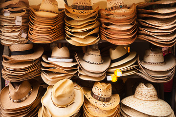 Image showing Western Wear Straw Hats Vendor Festival Cart