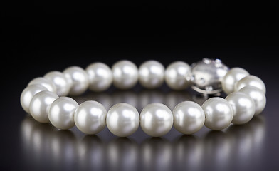 Image showing White pearls necklace on black
