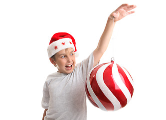 Image showing Boy with an oversized Chirstmas Bauble