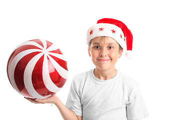 Image showing Child holding a large bauble