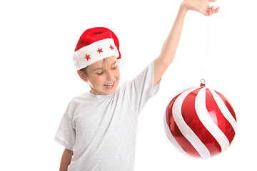 Image showing Child spinning large bauble