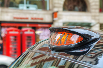 Image showing Famous black cab on a street in London