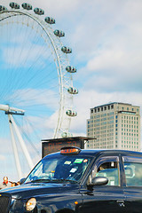 Image showing Famous black cab an a street in London