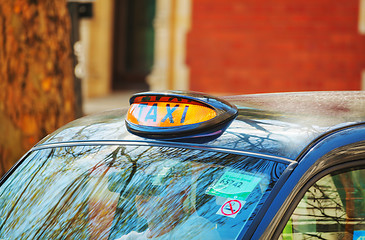 Image showing Famous black cab an a street in London