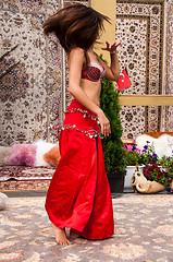 Image showing Girl on background of carpet Arab style