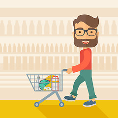 Image showing Male Shopper Pushing a Shopping Cart.