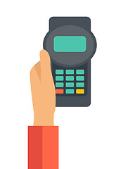 Image showing Holding credit card machine