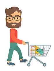 Image showing Male Shopper Pushing a Shopping Cart.