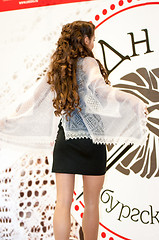 Image showing The girl in the Orenburg downy shawl,