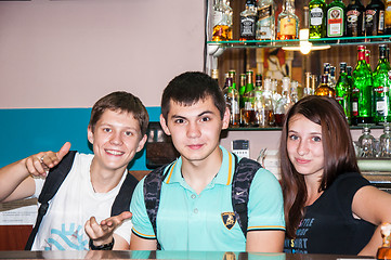 Image showing The young man behind the bar