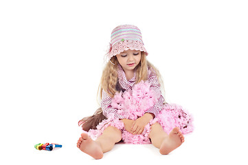 Image showing Happy little baby girl in pink tutu skirt and hat