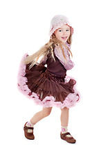 Image showing Dancing happy little girl in pink tutu skirt