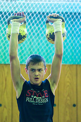 Image showing The boy in the kettlebell sport