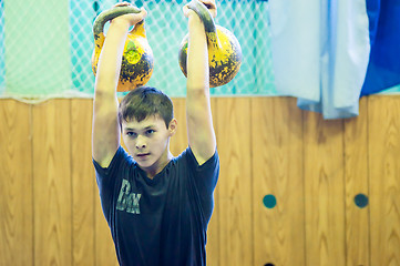 Image showing The boy in the kettlebell sport