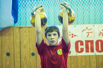 Image showing The boy in the kettlebell sport