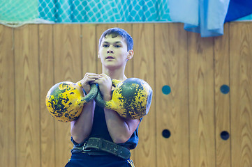 Image showing The boy in the kettlebell sport