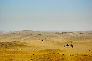 Image showing Bedouins with camels on Desert in Africa