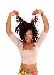 Image showing African woman pulling her hair.