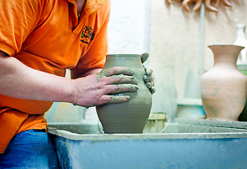 Image showing People at work: the production of ceramic vases on a Potter\'s wh