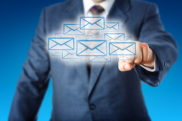 Image showing Business Man Touching A Cloud Of Many Email Icons