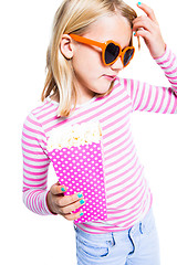 Image showing Girl eating pop corn