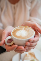 Image showing Cup of delicious coffee with a heart