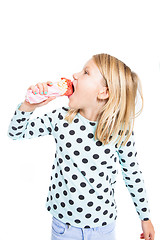 Image showing Girl eating strawberry ice cream