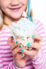 Image showing Girl holding ice cream dessert