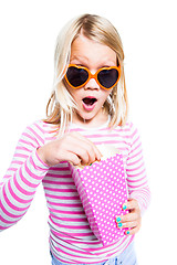 Image showing Girl eating pop corn