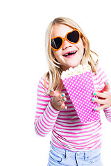 Image showing Girl eating pop corn