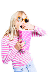 Image showing Girl eating pop corn