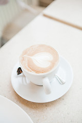 Image showing Cup of delicious coffee with a heart