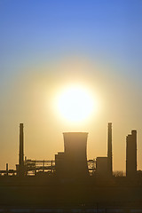Image showing silhouette of industrial factory at sunset