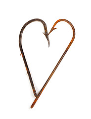 Image showing Old rusty fish hooks in form of heart