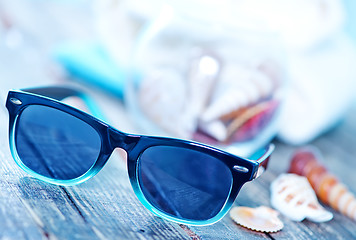 Image showing sun glasses and flip flops 